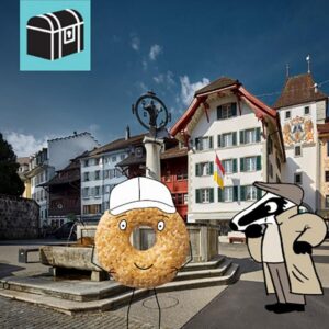 Erlebe die Detektiv-Trails mit Detektiv Dachs: Ein spannendes Rätselerlebnis für Jung und Alt. Du begibst dich auf eine Entdeckungstour durch die charmante Altstadt von Willisau, durch welches die Wigger fliesst. Der Trail führt dich vorbei am imposanten Obertor, dem historischen Landvogteischloss und der idyllisch an der Wigger gelegenen Kapelle St. Nikolaus. Unterwegs entdeckst du den Hirschpark, geniesst die Atmosphäre der lebendigen Altstadt und lernst die Geschichte von Willisau auf spielerische Weise kennen. Am Ende erwartet dich eine süsse Belohnung: die berühmten Willisauer-Ringli, die du im Laden auch gleich kosten kannst. Die abwechslungsreiche Route verbindet Geschichte, Rätselspass und Genuss zu einem unvergesslichen Erlebnis für Gross und Klein. Der Detektiv-Trail Willisau bietet eine harmonische Mischung aus Rätsellösen, Bewegung und Kulturgenuss. Perfekt für Familien, Kinder, Schulklassen, Grosseltern und alle, die gerne draussen unterwegs sind. Viel Vergnügen auf deinem Rätselabenteuer!