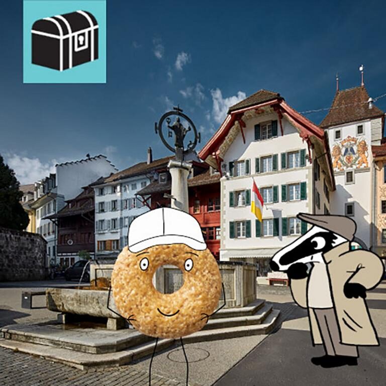 detektiv-trail-willisau-willisauer-ringli-landvogteischloss-wigger-hirschpark Erlebe die Detektiv-Trails mit Detektiv Dachs: Ein spannendes Rätselerlebnis für Jung und Alt. Du begibst dich auf eine Entdeckungstour durch die charmante Altstadt von Willisau, durch welches die Wigger fliesst. Der Trail führt dich vorbei am imposanten Obertor, dem historischen Landvogteischloss und der idyllisch an der Wigger gelegenen Kapelle St. Nikolaus. Unterwegs entdeckst du den Hirschpark, geniesst die Atmosphäre der lebendigen Altstadt und lernst die Geschichte von Willisau auf spielerische Weise kennen. Am Ende erwartet dich eine süsse Belohnung: die berühmten Willisauer-Ringli, die du im Laden auch gleich kosten kannst. Die abwechslungsreiche Route verbindet Geschichte, Rätselspass und Genuss zu einem unvergesslichen Erlebnis für Gross und Klein. Der Detektiv-Trail Willisau bietet eine harmonische Mischung aus Rätsellösen, Bewegung und Kulturgenuss. Perfekt für Familien, Kinder, Schulklassen, Grosseltern und alle, die gerne draussen unterwegs sind. Viel Vergnügen auf deinem Rätselabenteuer!