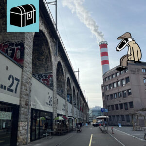 Das Bild zeigt das Viadukt im Zürcher Industriequartier Zürich West. Ebenfalls ist der Turm der Energiezentrale zu sehen und Detektiv Dach, der von einem Gebäude auf das Viadukt blickt.